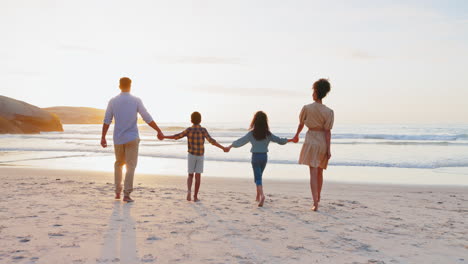 Back,-holding-hands-and-family-with-sunset
