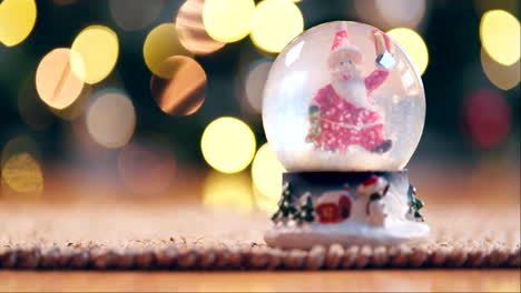 Christmas,-snow-globes-or-decoration-on-table