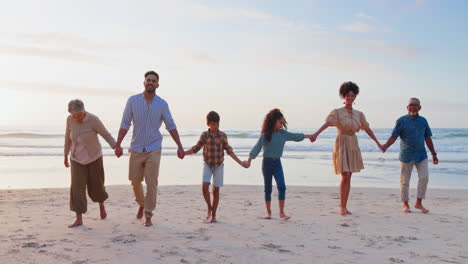 Smile,-holding-hands-and-family-with-beach