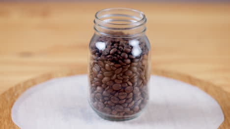 Coffee,-beans-and-closeup-on-jar-container