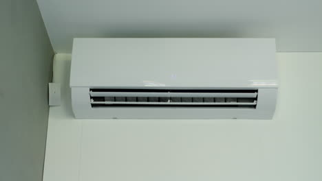 Air-conditioner-operation,-flow-louvers-move-up-and-down.-Low-angle-view