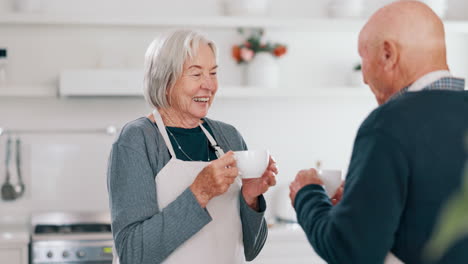 Senior-couple,-laughing-and-coffee-in-a-kitchen