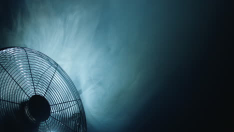The-fog-is-sucked-in-by-the-fan-blades.-The-movement-of-air-currents-is-visible