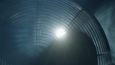 Fan-blades-rotate-in-rays-of-light-and-fog.-Close-up-shot