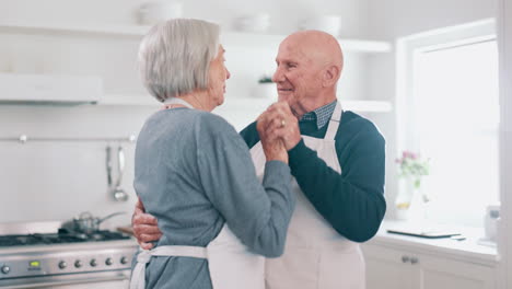 Senior-couple,-dancing-and-kitchen-with-cooking
