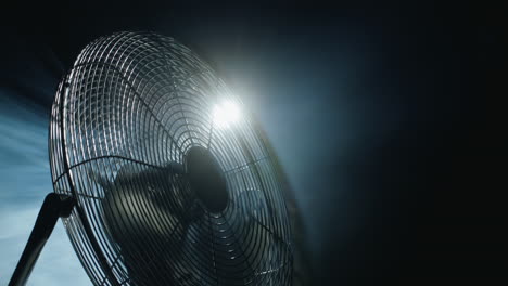 Fan-blades-rotate-in-rays-of-light-and-fog