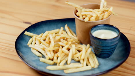 Person,-hand-and-fast-food-dipping-french-fries