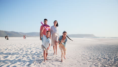 Parents,-children-and-airplane-toys-at-beach