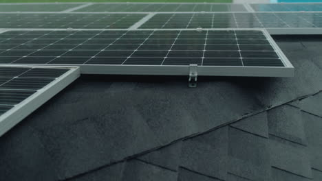 Drops-of-rain-fall-on-the-solar-panels-on-the-roof-of-the-house