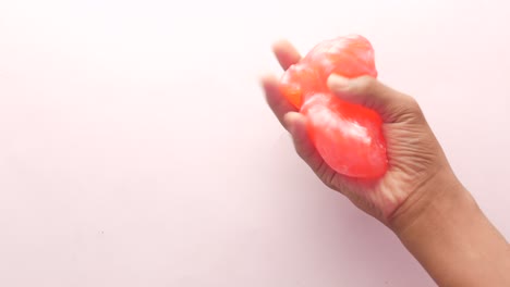 Child-hand-holding-pink--slime