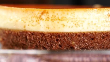 Caramel-custard-pudding-on-a-plate-on-table-,