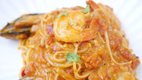Plate-of-sea-food-pasta-on-table