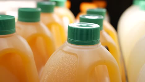Plastic-bottle-of-orange-juice-in-a-shelf-,