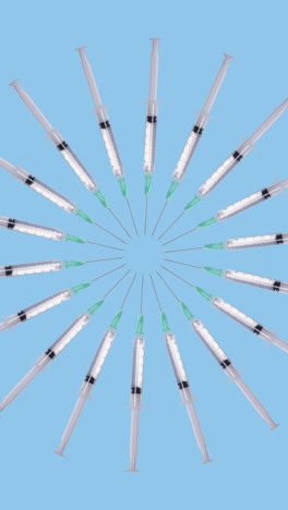 syringes-made-into-a-circular-abstract-pattern-vertical