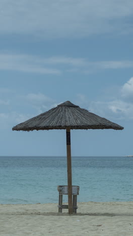 maragkas-beach-in-naxos-island-greece-with-sun-umbrellas-in-vertical