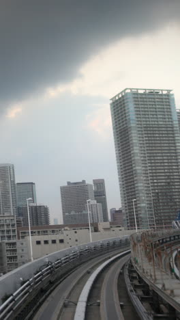 tokyo-monorail-passing-through-the-city's-skyscapers-in-vertical