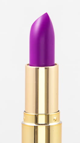 lipstick-turning-against-a-plain-white-background-in-vertical-format
