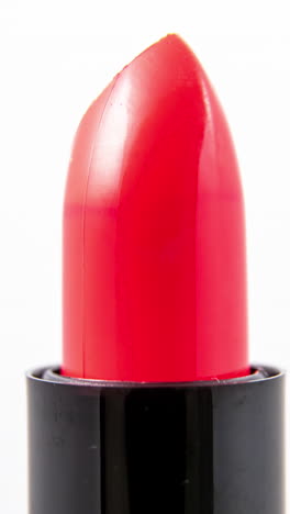 lipstick-turning-against-a-plain-white-background-in-vertical-format