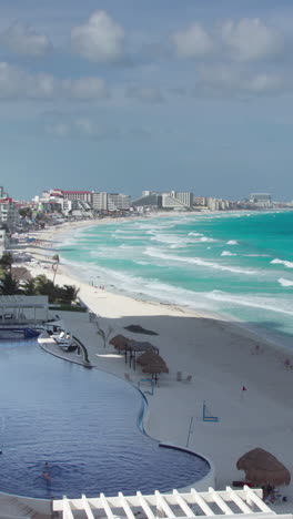 bay-of-hotels-stretching-along-the-coast-in-cancun,-mexico-in-vertical