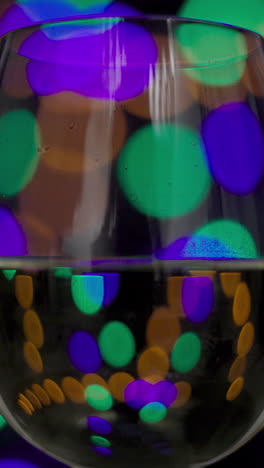 red-wine-in-disco-lights-in-vertical-video