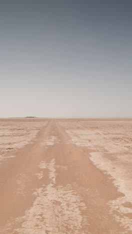 driving-in-sahara-desert,-morocco-in-vertical