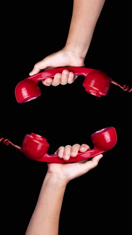 red-vintage-telephone-handsets-in-vertical