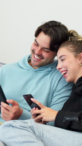 Phone,-laughing-and-couple-watching-video