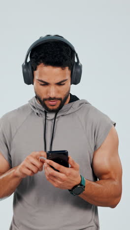 Man,-headphones-and-smartphone-with-music