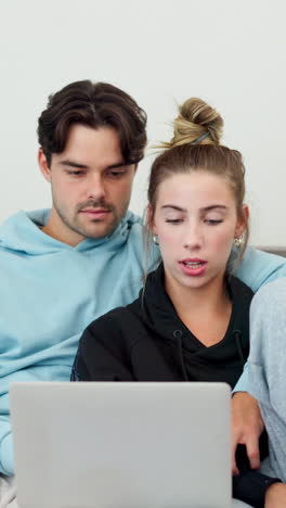 Laptop,-love-and-couple-watching-a-movie-together
