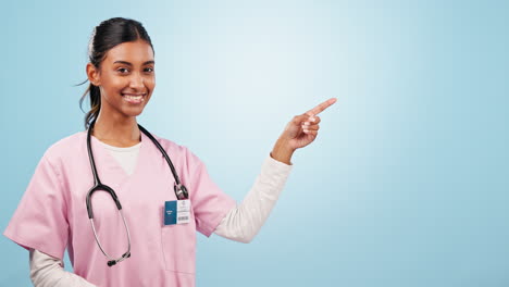 Pointing,-smile-and-face-of-woman-nurse