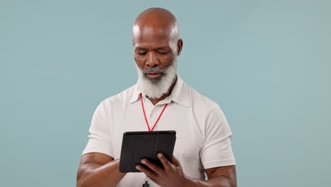 Happy,-black-man-or-coach-with-a-tablet-on-a-blue