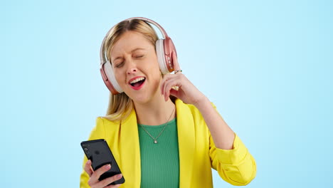 Woman,-headphones-and-phone-for-singing-to-music