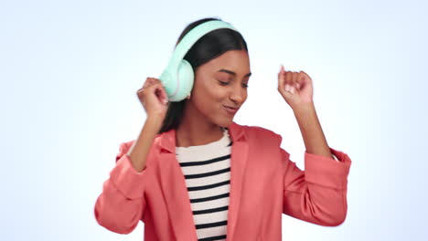 Headphones,-dancing-and-young-woman-in-a-studio