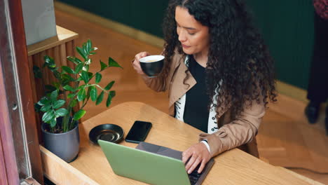 Laptop,-cafe-tea-cup-and-woman-typing