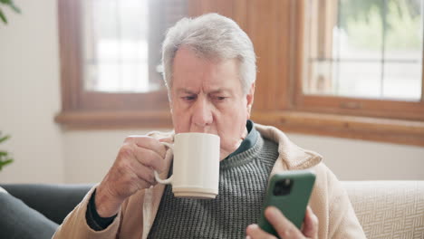 Coffee,-phone-and-senior-man-on-sofa