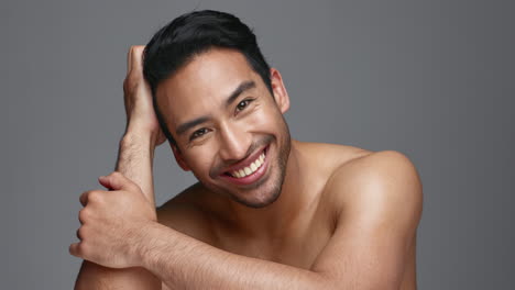 Face,-cosmetics-and-Asian-man-with-skincare