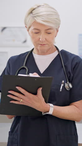 Clipboard,-hospital-and-senior-doctor-writing