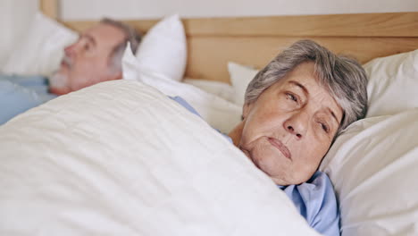 Frustrated-senior-couple,-bed