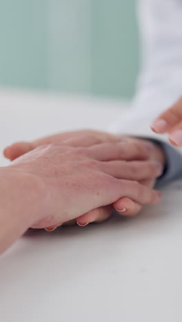 Closeup,-holding-hands-and-doctor-with-a-patient