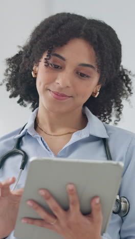 Tablet,-smile-and-woman-doctor-reading-information