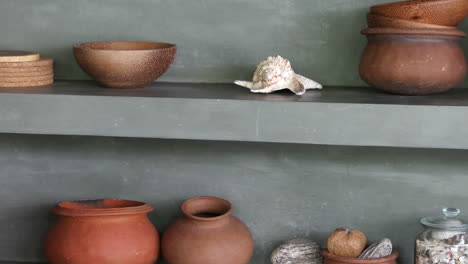 Rustic-Design-Clay-Pots,-Wooden-Coaster,-Bowl-With-Shells-Displayed-In-A-Shop-In-Sri-Lanka