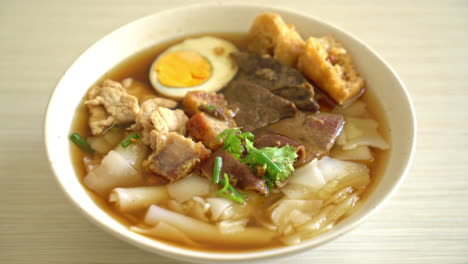 paste-of-rice-flour-or-boiled-Chinese-pasta-square-with-pork-in-brown-soup