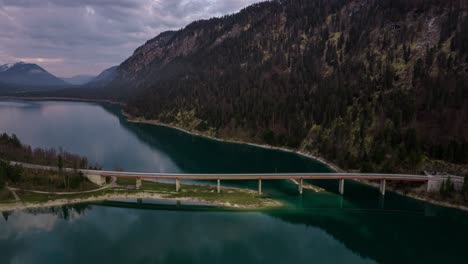 Bridge-over-mountain-lake-Sylvenstein,-Bavaria,-Germany