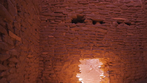 Inside-a-weathered-tower-with-sandstone-brick-walls