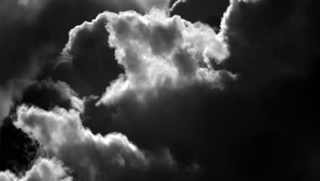 Black-and-white-clouds-moving-slow-in-light