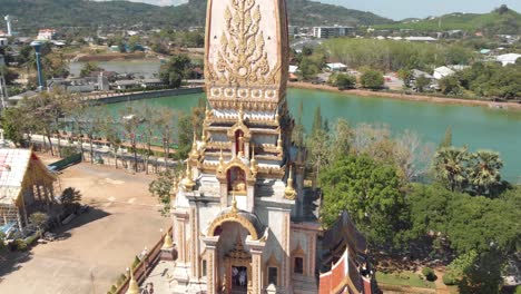 Pagoda-tower-of-Wat-Chalong-in-Mueang-District,-in-Phuket,-Thailand---Aerial-tracking-Orbit-medium-shot