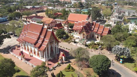 Fly-over-survey-view-of-Chalong-Temple-grounds-and-shrines-in-Phuket,-Thailand---Aerial-Fly-over-low-angle-panoramic-shot