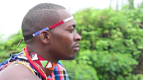 young-Maasai-man-listening-to-someone-else-talk