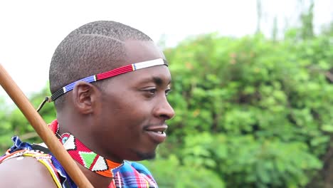 young-Maasai-man-is-happy-listening-to-music-while-smiling