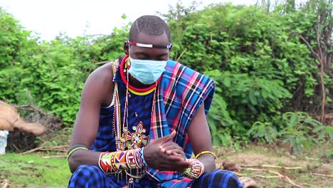 Maasai-man-greeting-with-hello-wearing-his-covid-mask